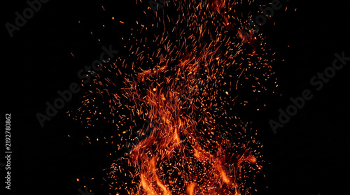 Fire sparks photo with bright glowing embers and hot flames rising against a dark black background