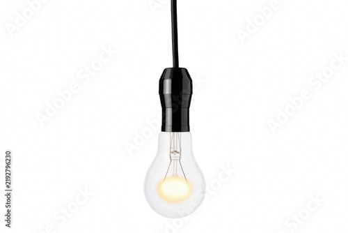 фотографія Illuminated incandescent bulb with warm filament glow