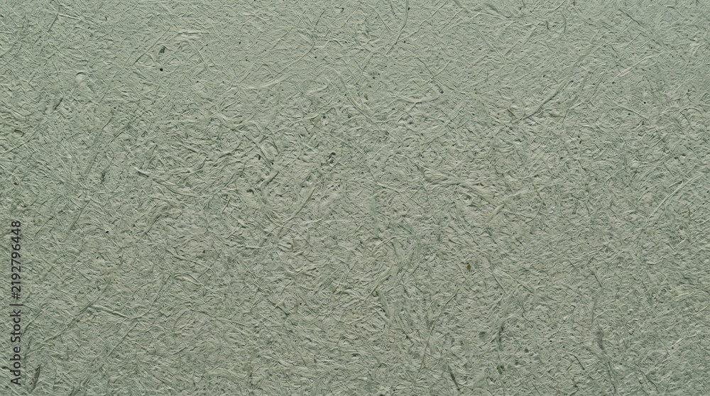 Fototapeta premium Macro close up of sage green textured paper surface with natural fibers
