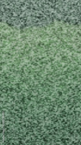 Abstract green static background resembling television noise. 2d animation