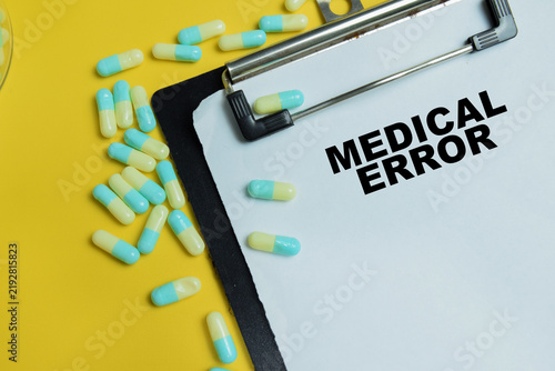 Obraz na płótnie Concept of medical error write on clipboard isolated on table.