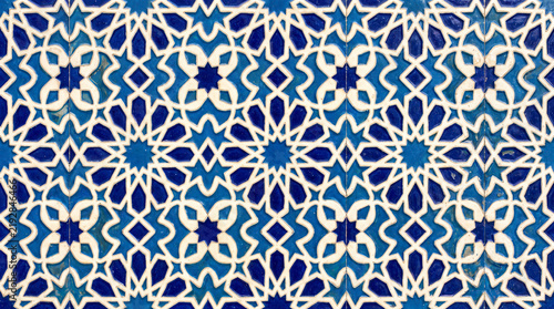 Intricate Islamic Geometric Pattern: A mesmerizing display of traditional Islamic geometric art, featuring repeating star and polygonal motifs in a vibrant blue and white palette.