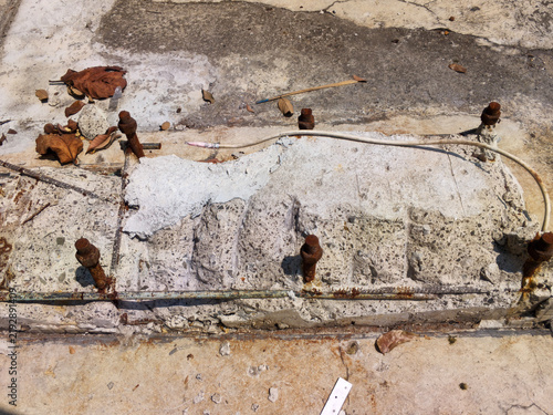 Konstfotografi A close‑up of deteriorating concrete reveals cracks, chipped areas, and exposed aggregate