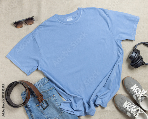 Blank light blue unisex t-shirt mockup, crewneck flat lay with denim jeans and mens accessories