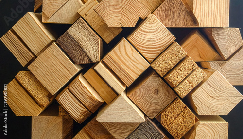 Close up of assorted geometric timber pieces and wooden offcuts piled together creating a unique textured pattern for industrial and woodworking design template
