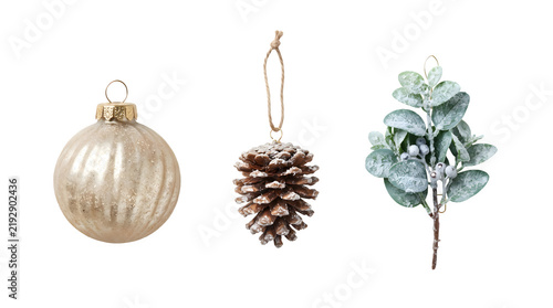 Set of christmas ornaments including a glass bauble, a pinecone, and a frosted greenery branch isolated on transparent background
