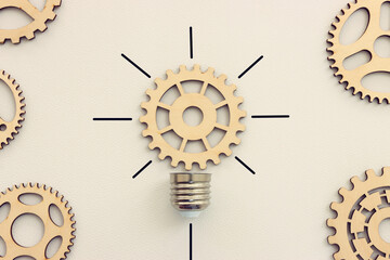 Spinning gear as light bulb concept. Idea of innovation and creativity