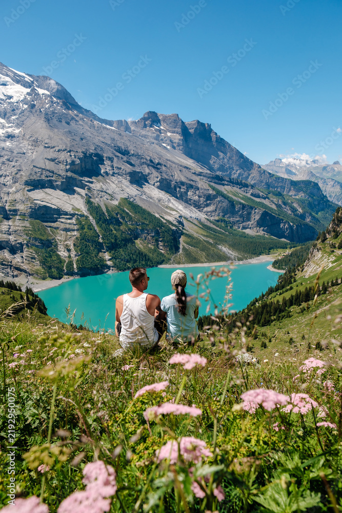 Obraz premium Majestic Oeschinensee lake view surrounded by lush mountains in Switzerland