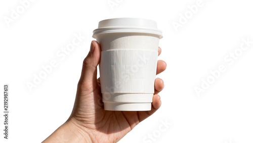 Hand holding a white paper coffee cup with a sleeve, isolated on transparent background