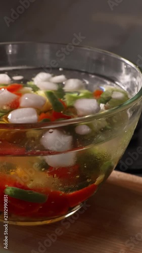 Cooling blanched vegetables in an ice bath after boiling