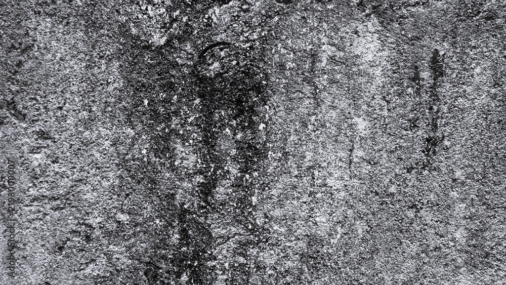 Obraz premium Dark weathered wall texture featuring rough concrete grain, irregular stains, distressed surface details, and high contrast monochrome background.