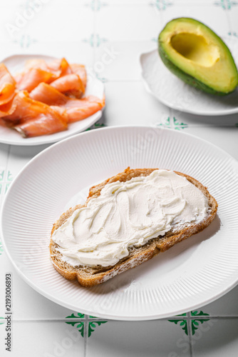 Ingredients for bruschetta with avocado and cream cheese