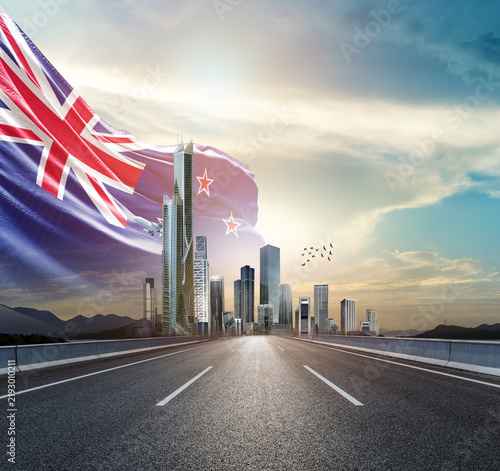 Bild auf Leinwand New Zealand national flag waving behind the cityscape