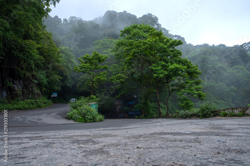Hairpin curve on the misty mountain ghaut road from Mannarkkad to Attappadi, Kerala, India.
