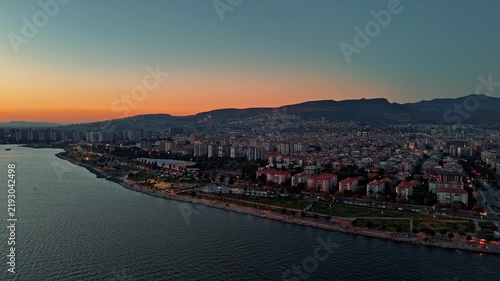Aerial View of Bostanli Coastline and Residential Cityscape at Sunset in Izmir Turkey