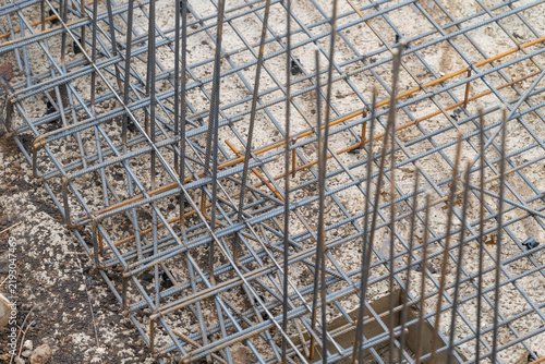 Konstfotografi Excavation pit revealing sturdy framework ready for concrete in a bustling const