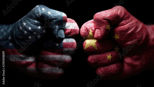 Fists adorned with flags clash in a symbolic representation of conflict and geopolitical rivalry