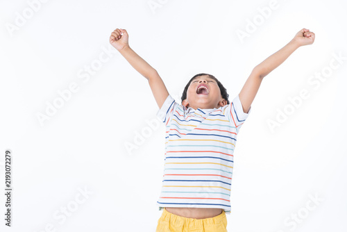Принти на полотні Excited young boy raising arms and shouting in triumph