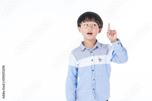 Thoughtful Young Boy Wearing Glasses Pointing Upward with Idea Gesture