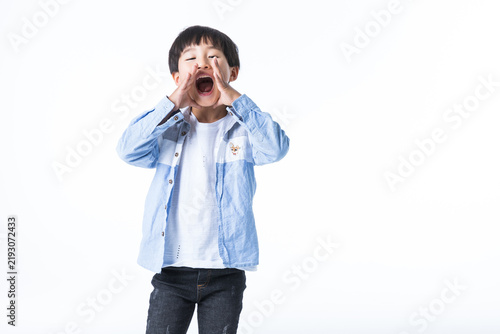 Young Boy Shouting Loudly with Hands Cupped Around Mouth on White Background