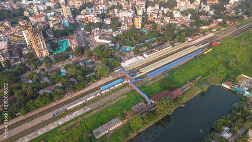 Cuadro en lienzo Aerial view of a railway station in a densely populated urban area in bangladesh