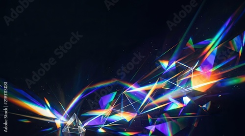 Fractured light explodes across a dark background, creating a dynamic and abstract composition.