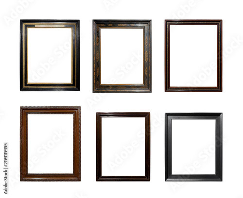 Collection of antique dark wooden picture frames isolated on white background