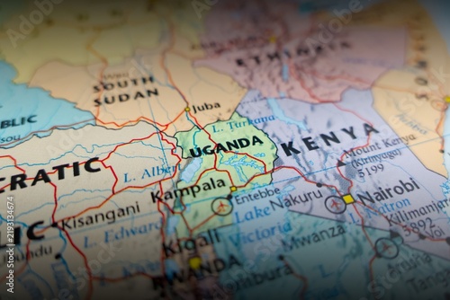 Map of Uganda with shadowed top and bottom. Selective focus on label, close-up view