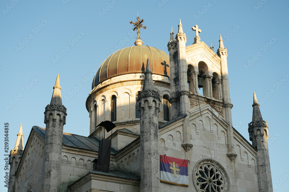 Fototapeta premium Church of St. Michael the Archangel on Belavista Square in the Old Town of Herceg Novi, Montenegro, featuring Byzantine, Gothic and Romanesque architectural elements