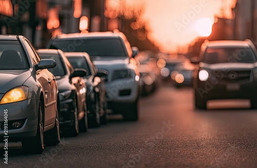 Rush Hour Traffic Jam at Sunset with Cars Lined Up on Road.