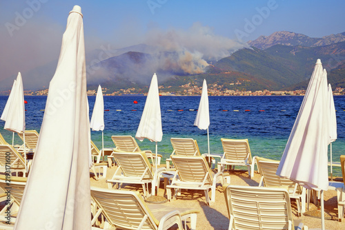 Forest fire in mountains from very hot weather. Montenegro, Bay of Kotor, Tivat
