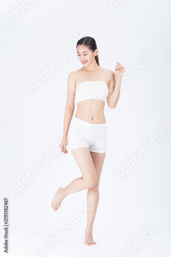 Foto Young Asian Woman in White Underwear Posing on White Background