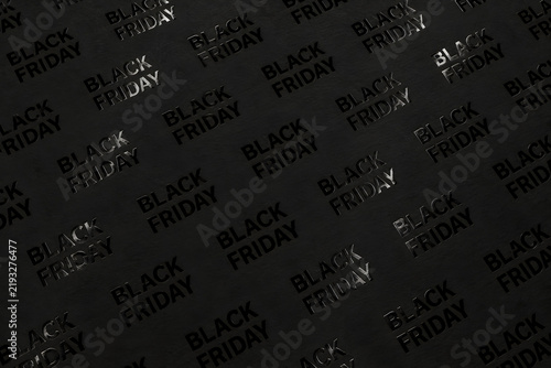 Black Friday background with repeating glossy black lettering embossed on textured matte black paper, creating an elegant monochrome retail sale pattern.