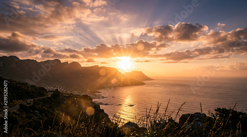 Sunset over calm ocean with mountains