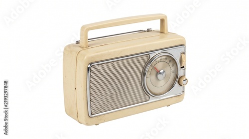 Vintage portable transistor radio with cream colored plastic casing and chrome accents on white background