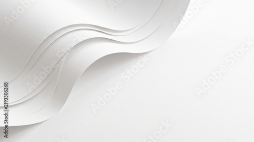 Elegant white paper waves abstract background with smooth curved lines and soft shadows
