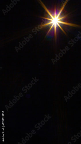 Sun flare on the black background
