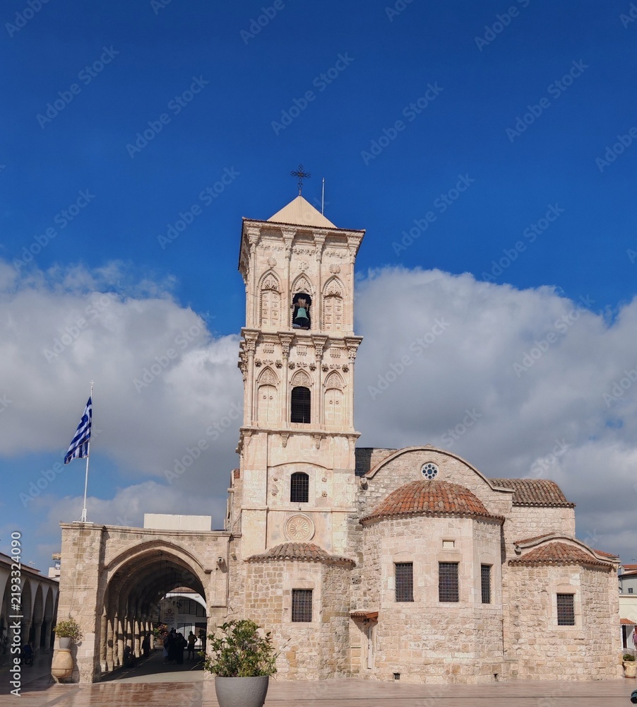 Fototapeta premium Historic Byzantine Church of Saint Lazarus in Larnaca Cyprus with bell tower against blue sky
