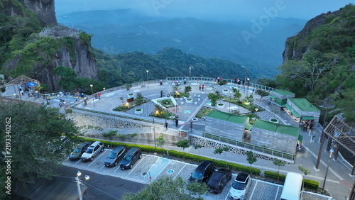 Aerial view of Centro Recreativo Cultural Puerta del Diablo with its observation deck and parking area between rocky cliffs in Planes de Renderos, San Salvador Department, El Salvador.