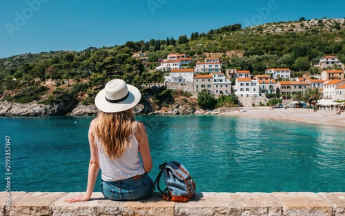 Woman looking at a coastal town