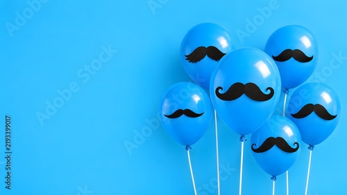 Bright blue balloons with stylish black mustaches are arranged on a vibrant blue backdrop