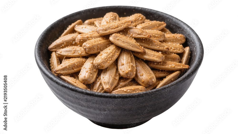 Fototapeta premium Roasted salted sunflower seeds in a dark bowl, isolated on transparent background