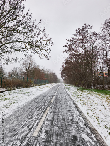 Winter arriving on a snow covered path