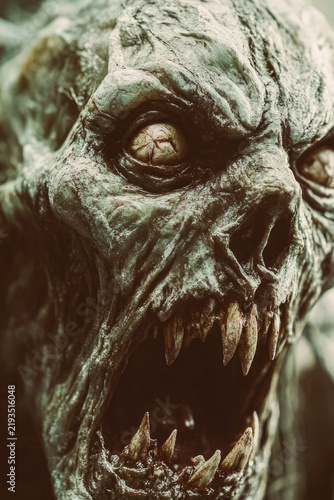 A detailed view of a statue depicting a reanimated corpse, great for Halloween or horror-themed designs. vertical frame