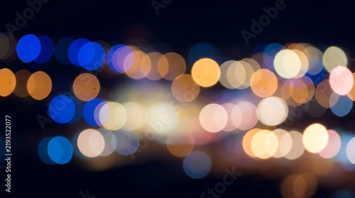 Abstract background of blurred city lights in shades of blue and orange with defocused abstract background colorful wallpaper artistic contrast