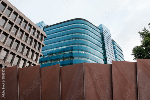 Canvas Print Modern glass building and concrete facade with rusty panels