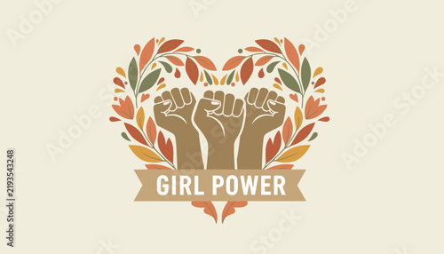 Feminism and girl power concept showing three raised fists inside a beautiful heart-shaped wreath of autumn leaves.