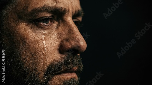 Dramatic Close-Up Portrait of a Sad and Emotional Man