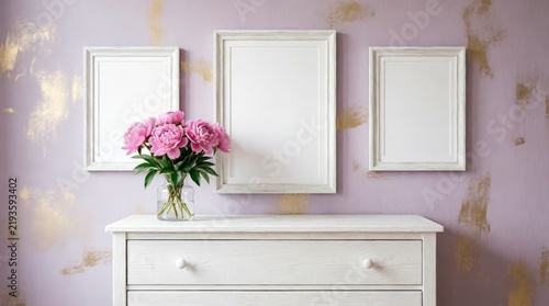 White Picture Frames on Lavender Wall with Pink Peonies in Glass Vase for Interior Design
