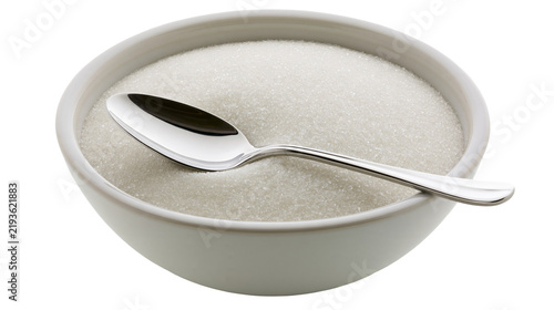 Fotografie Isolated bowl of white granulated sugar with a shiny silver spoon, sweet ingredi